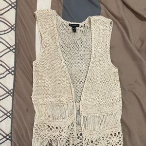 Cream crochet fringe vest.